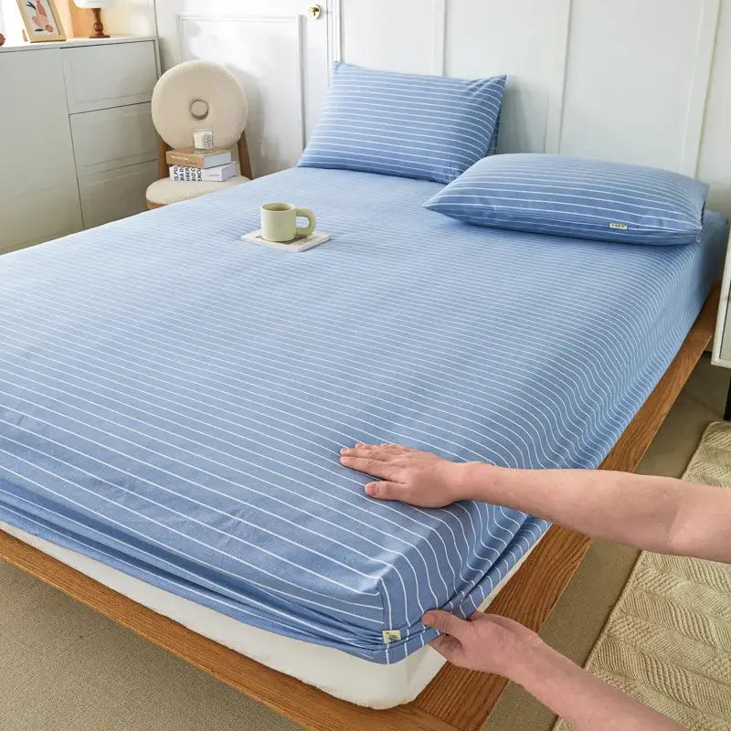 Blue and beige checkered decorbites coarse cotton queen fitted sheet paired with pink and white striped soft sheet