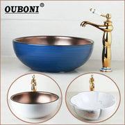 Blue and copper hand painted ceramic vessel sink set with gold-toned faucet for bathroom use