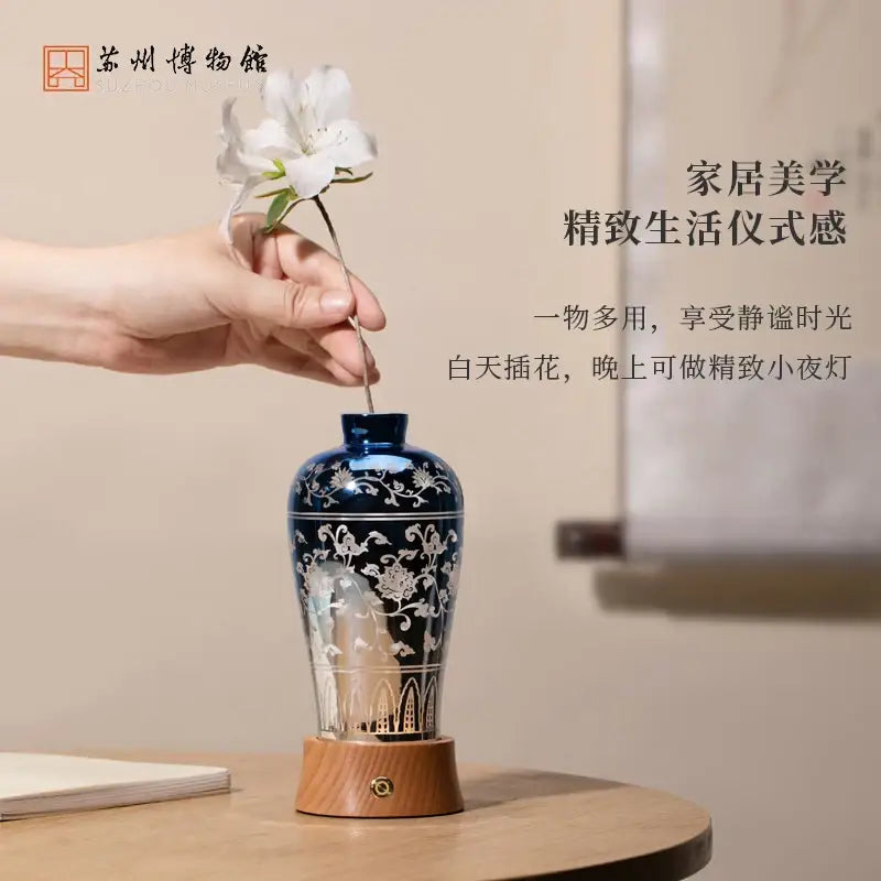 Deep blue ceramic liuguang qingying vase night light with white floral scrollwork wooden base and brass accent decorbites