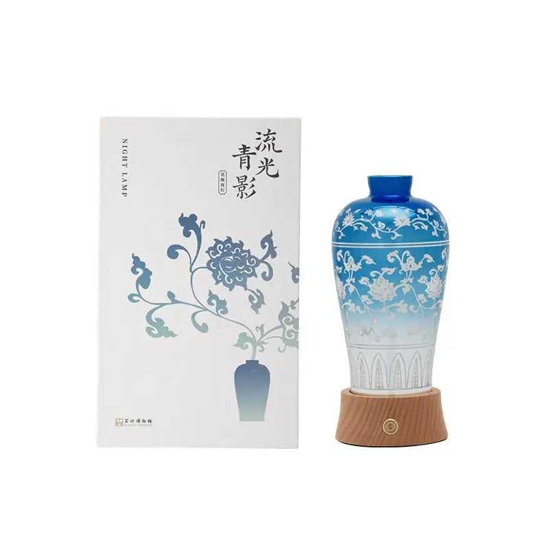 Blue and gold ceramic night light liuguang qingying vase with blue gradient and white floral patterns on wooden base