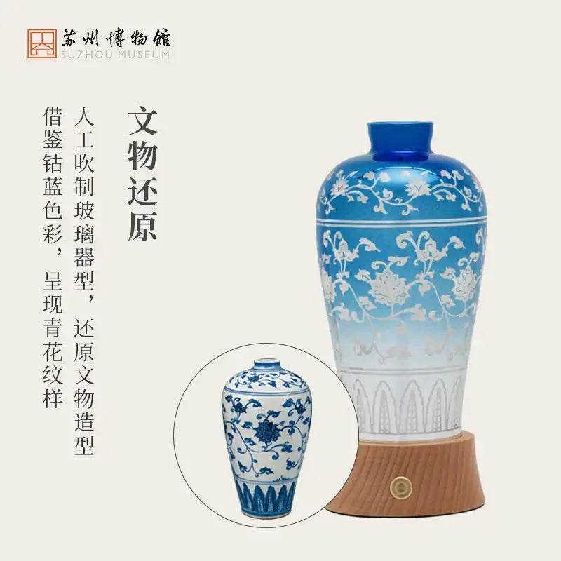 A tall slender blue and white glass vase with intricate floral patterns used as decorbites liuguang qingying night light table lamp