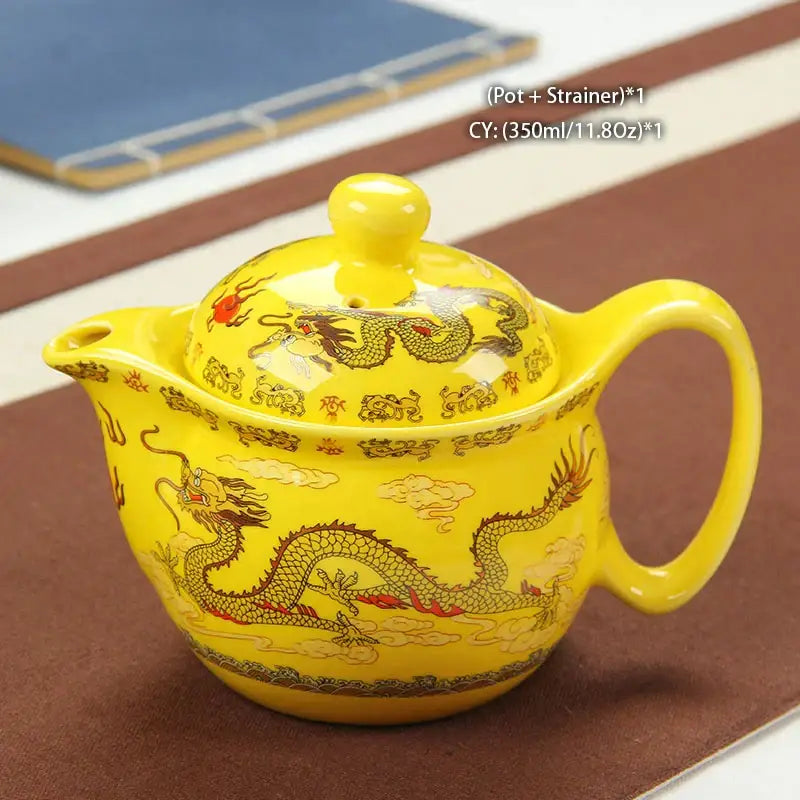 Vibrant yellow ceramic decorbites dragon teapot with golden red motifs, matching lid and handle for dragon teapot tea set