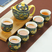 Blue and gold dragon teapot tea set with dark blue ceramic glaze and intricate golden dragon decorbites dragon teapot design