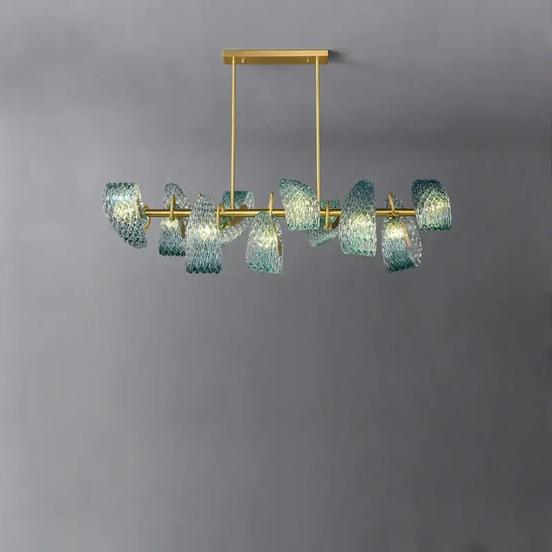 A modern blue and gold petal glass led copper pendant light with teal shades for dining room decorbites g9 led