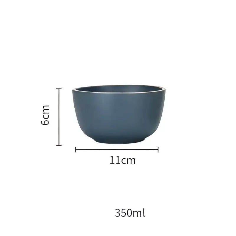 A sleek matte dark blue ceramic morandi bowl with smooth rounded rim and sturdy base from decorbites ceramic dinnerware