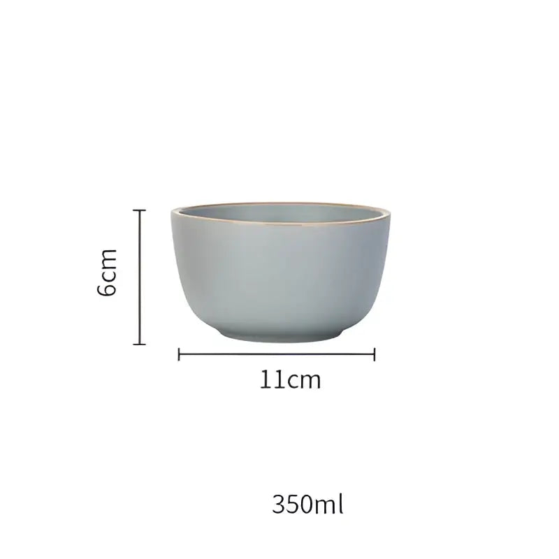 A sleek matte light blue ceramic morandi bowl with subtle texture and gold trim for dining room decorbites ceramic morandi
