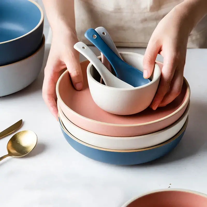 Stack of pastel blue and gray ceramic morandi bowls with gold rims from decorbites ceramic morandi dinnerware set
