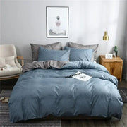 Blue and gray grain pattern duvet cover set with blue denim-like fabric and matching pillows with a gray accent pillow