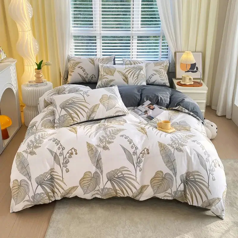 White duvet cover with gray and olive green botanical print paired with dark gray decorbites cotton single duvet cover