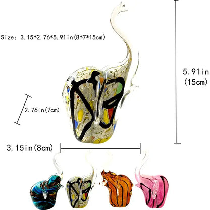 A translucent glass swan figurine with colorful abstract patterns displayed alongside a crystal glass elephant sculpture