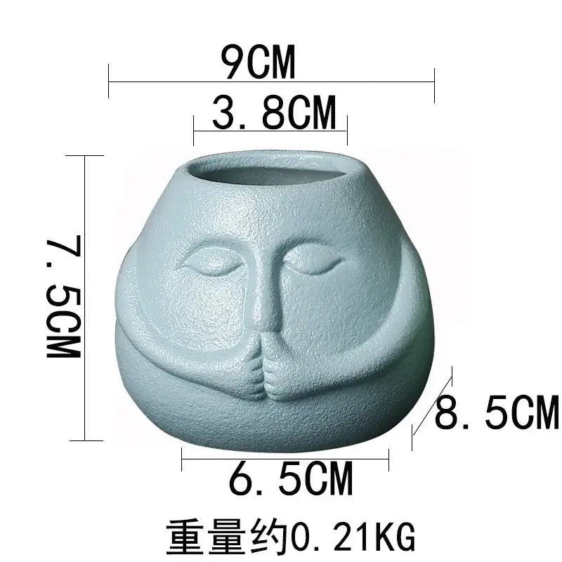 A light gray ceramic abstract human face planter with textured serene features for living room decorbites decorbites ceramic abstract decor