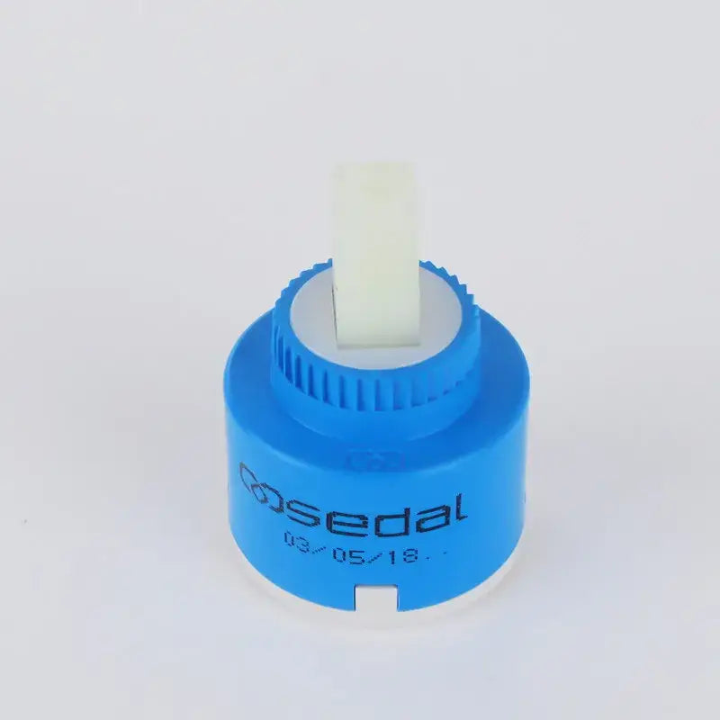 Blue and white ceramic cartridge faucet mixer with a blue plastic body and white ceramic stem for kitchen spindle use