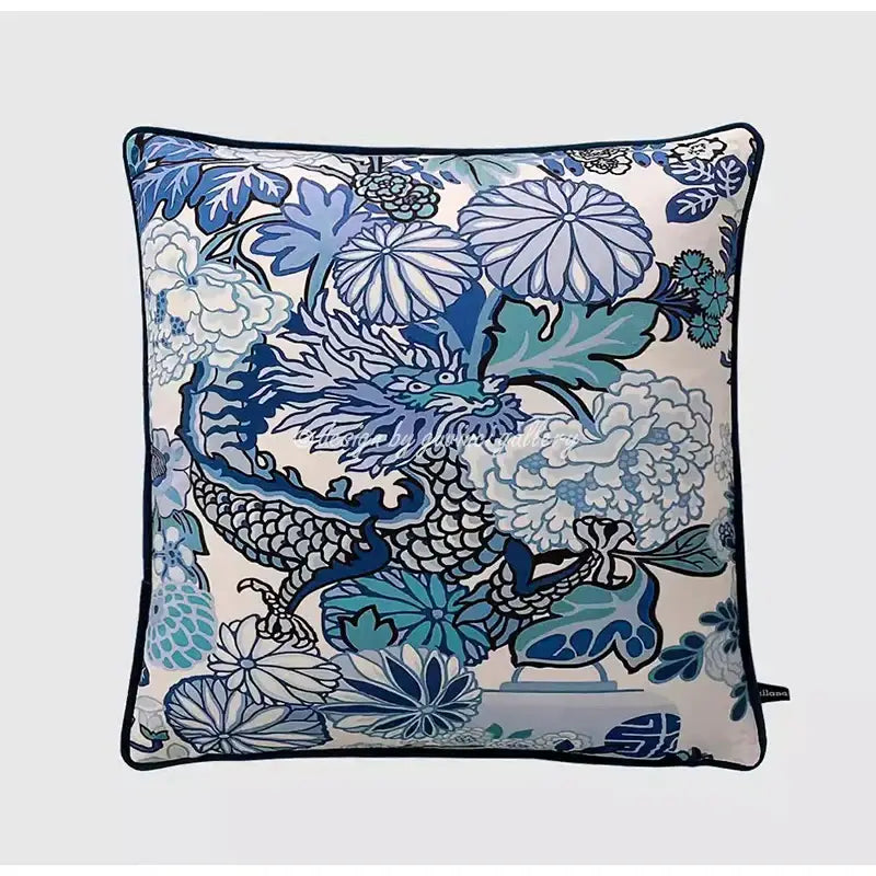 Square throw pillow case featuring a vibrant blue and white dragon with floral patterns and navy trim for living room use