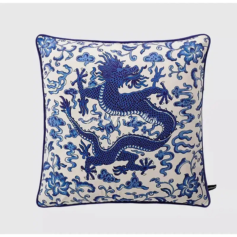 Square throw pillow case featuring a blue dragon embroidery on off-white background with floral and cloud motifs