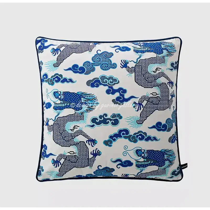 Blue and white throw pillow case featuring intricate blue dragons and clouds on white background with navy trim