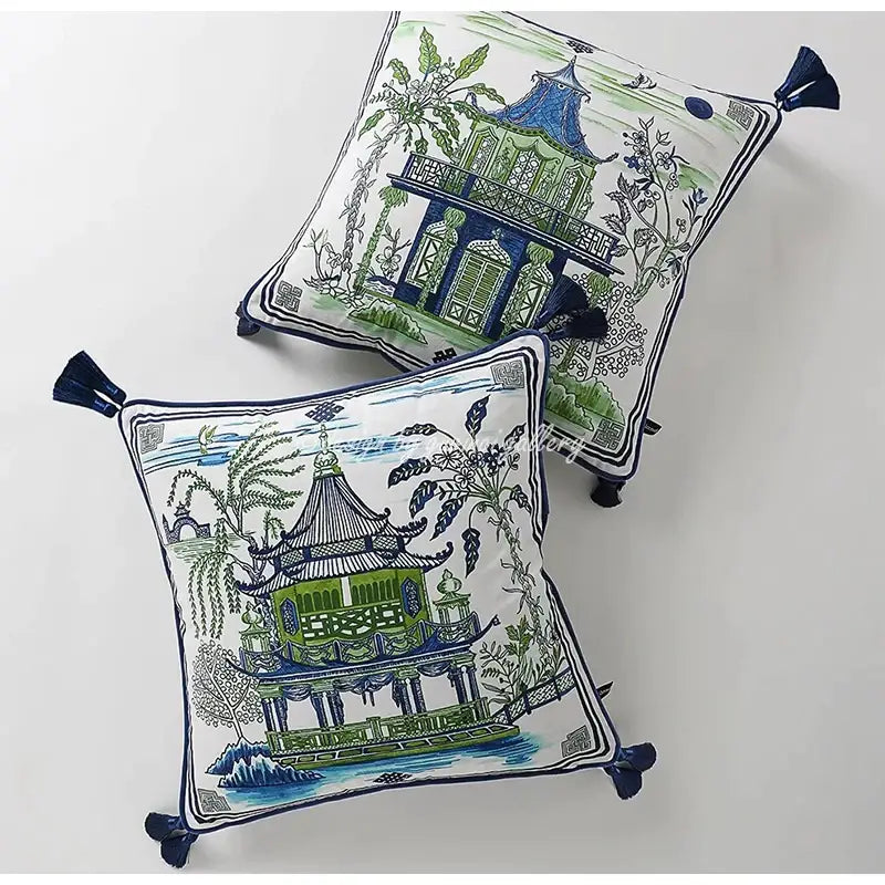 Square throw pillow case with embroidered blue and green chinese-style pavilions and navy tassels on white background