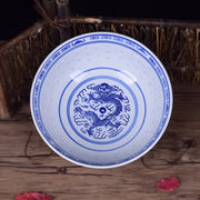 White ceramic ramen bowl with intricate blue dragon pattern and yin-yang decorbites dragon pattern porcelain design