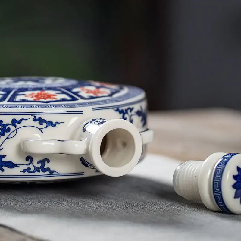 White eight treasures ceramic flask with blue and red floral patterns for living room ornament
