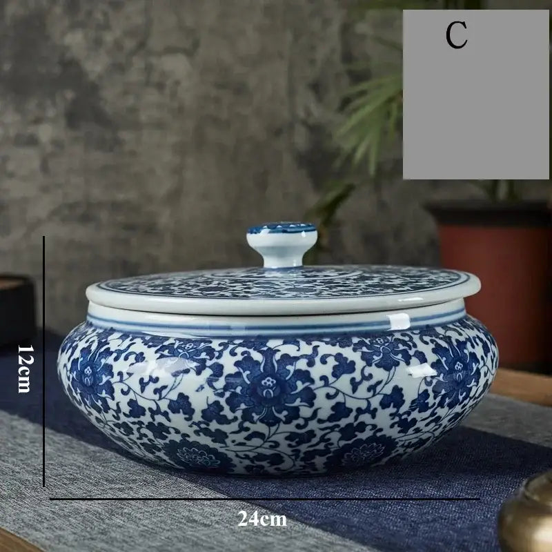Blue and white floral ceramic tea caddy jar with intricate patterns and matching lid for living room decor