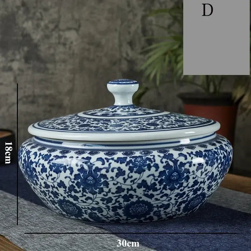 Blue and white floral ceramic tea caddy jar with intricate patterns and matching lid for living room decor