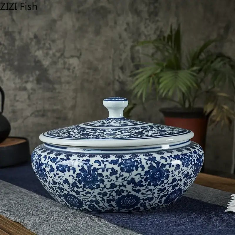Blue and white floral ceramic tea caddy jar with intricate patterns ideal for living room decor and tea storage