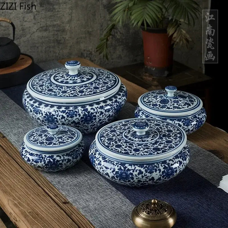 Set of four blue and white floral ceramic tea caddy jars with intricate patterns for living room decor