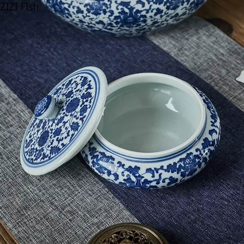 Blue and white floral ceramic tea caddy jar with intricate patterns ideal for living room decor and tea storage