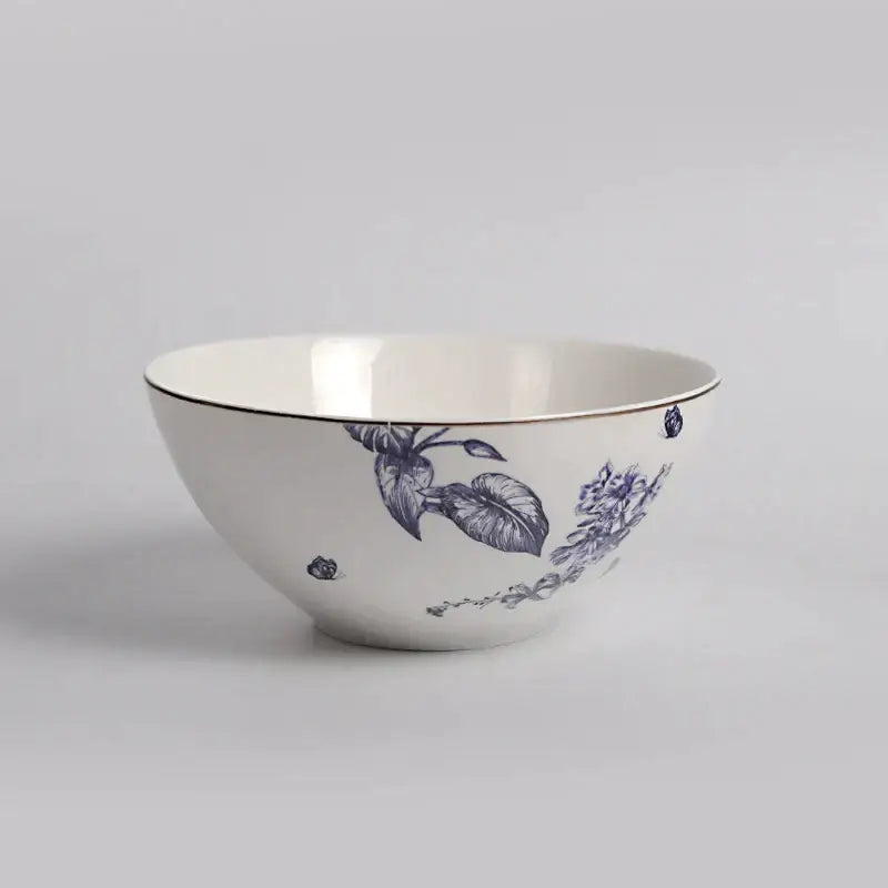 White ceramic bowl with blue floral patterns and gold rim from decorbites kitchenware fruit plates for dining experience