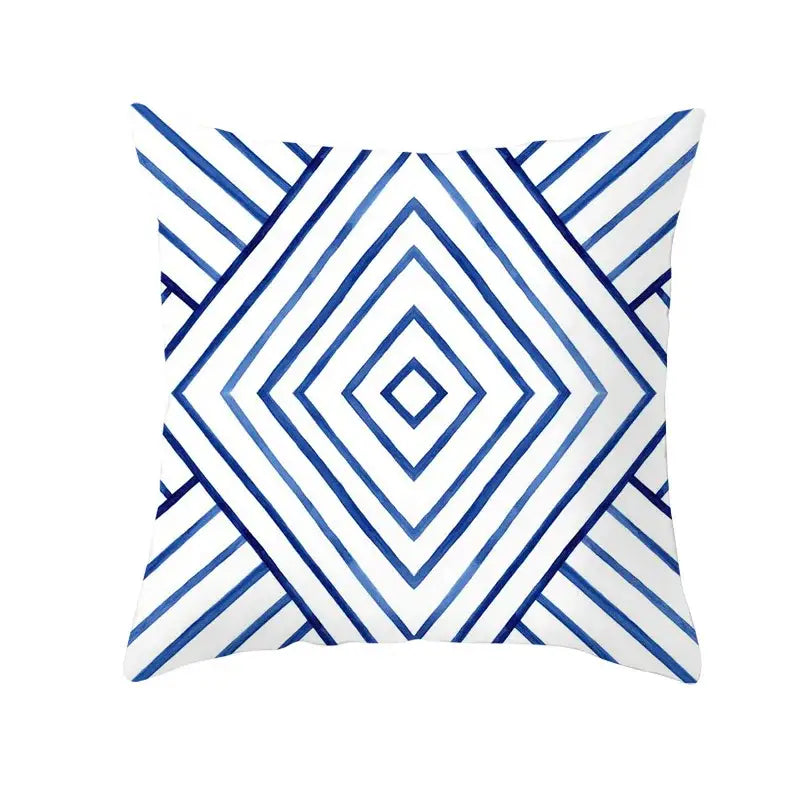 White throw pillow with blue geometric heart pattern featuring concentric diamond shapes for living room decorbites geometric heart round use