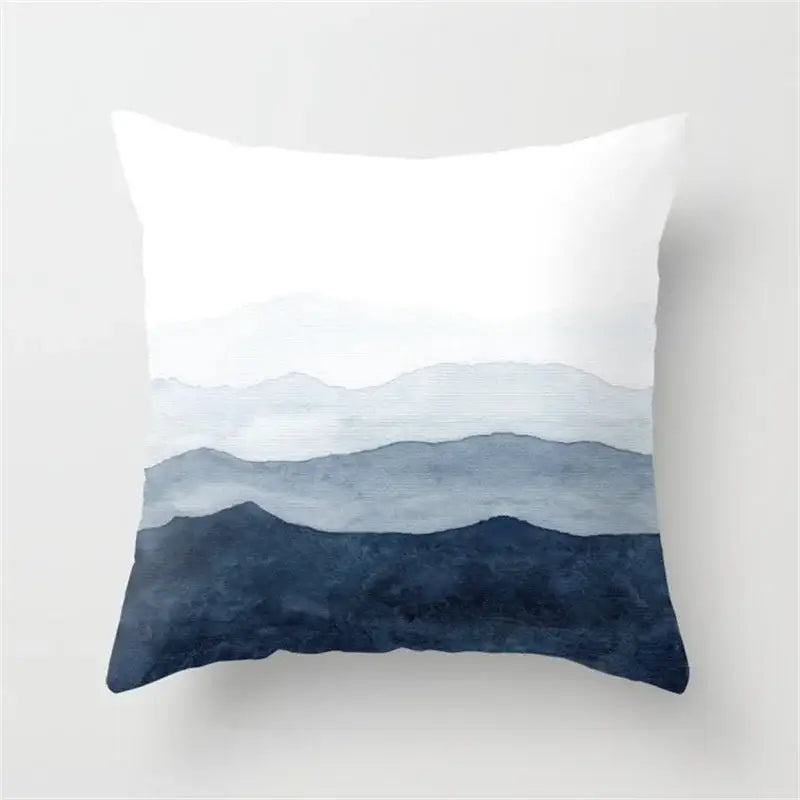 A square throw pillow with a blue and white watercolor mountain design for decorbites geometric heart round decor
