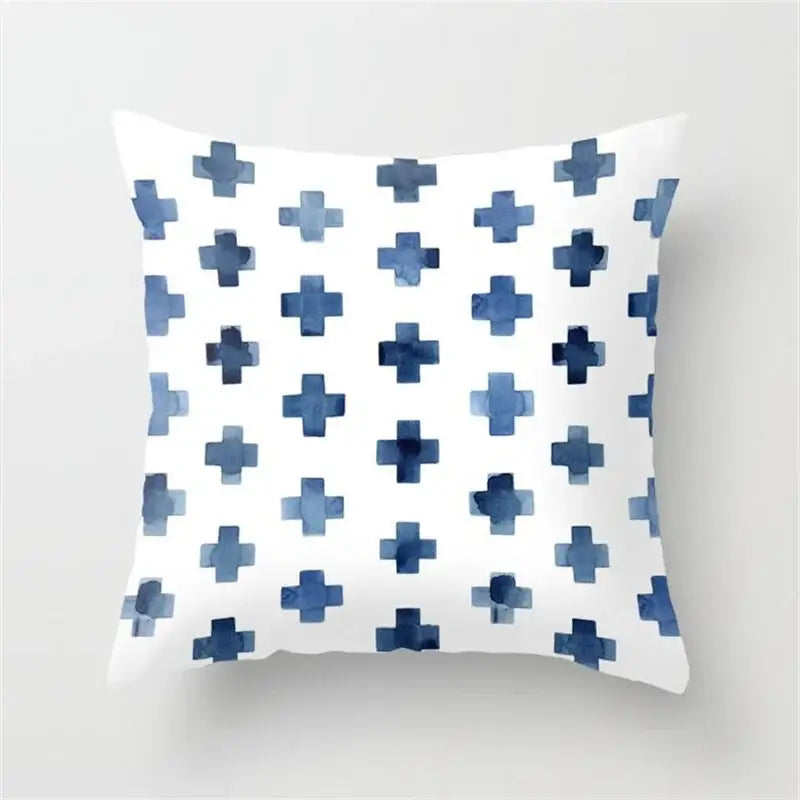 White throw pillow with blue watercolor crosses featuring decorbites geometric heart round pattern for living room decor