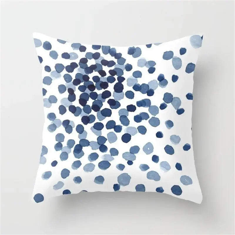White throw pillow with blue watercolor dots featuring a decorbites geometric heart round design for living room decor