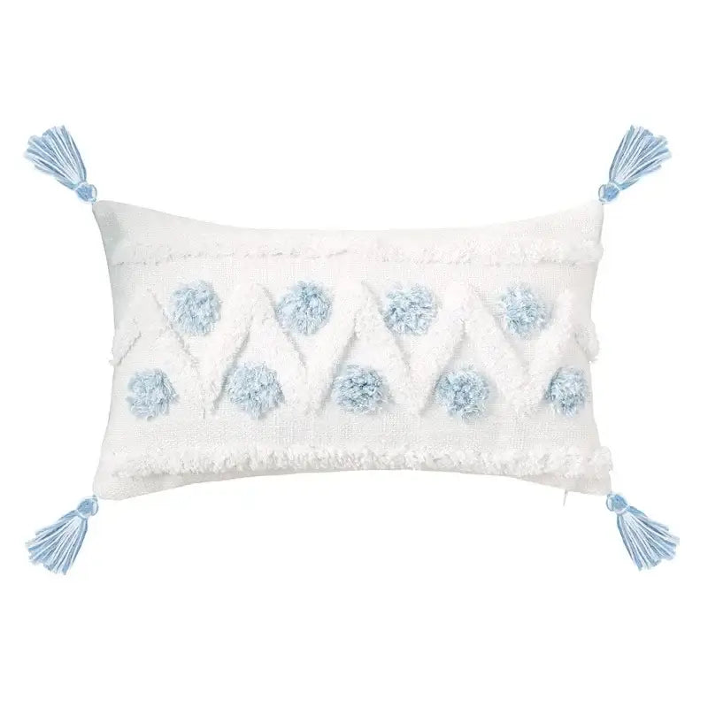 White rectangular pillow with light blue pom-poms and tassels from decorbites blue geometric tufted pillowcase set