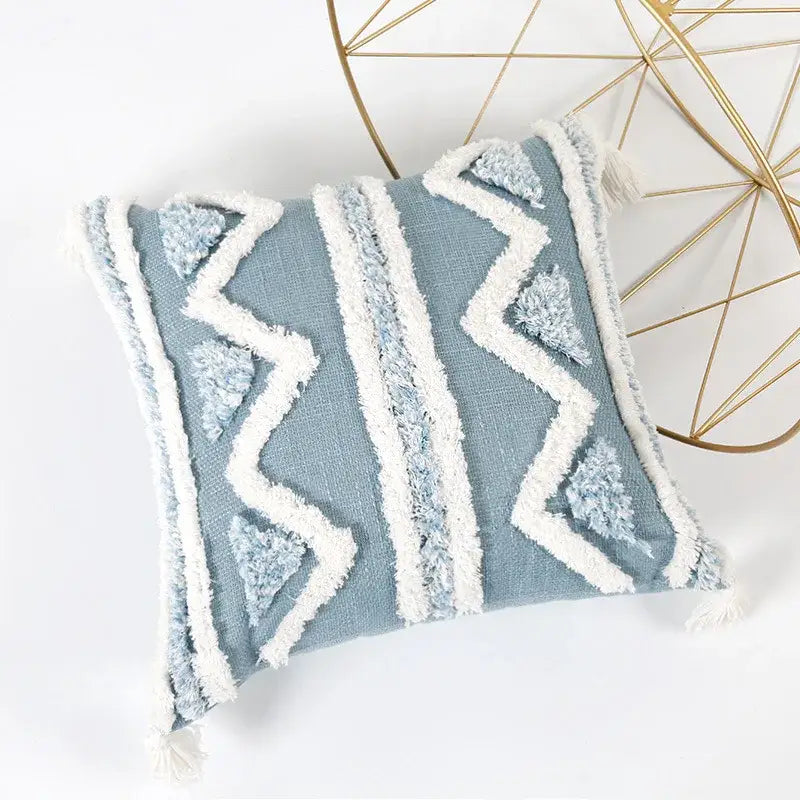 A light blue and white geometric tufted pillowcase set featuring woven texture and tassels for bedroom decorbites blue geometric style