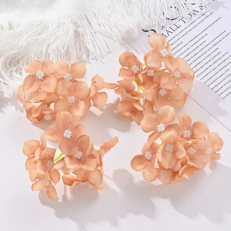 Delicate peach-colored artificial hydrangea flowers with white centers made from soft fabric for decorbites hydrangea decor