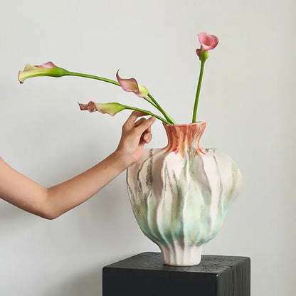 A handcrafted irregular porcelain tulip vase with fluted form and mint green white peach glaze for living room decorbites decor