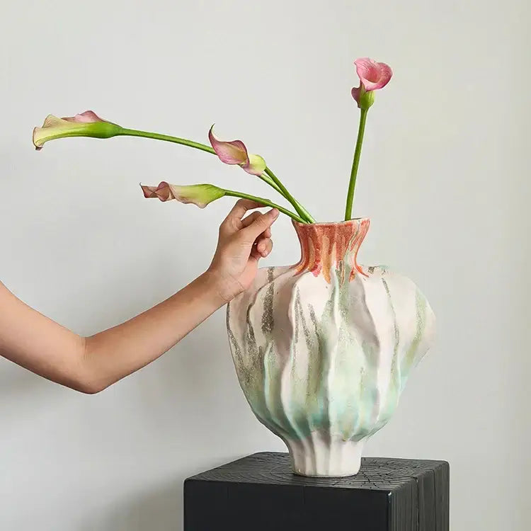 A handcrafted irregular porcelain tulip vase with fluted form and mint green white peach glaze for living room decorbites decor