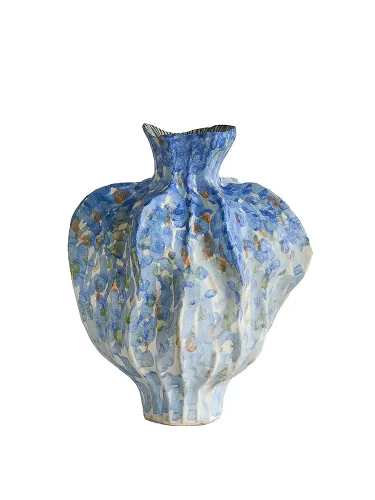 A textured blue and white irregular porcelain tulip vase with fluted organic shape for living room decorbites decor