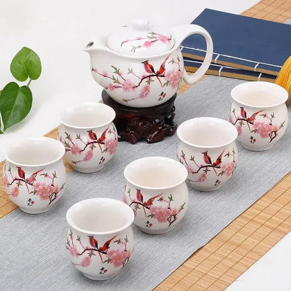 Blue and white double ceramic teaware set featuring white ceramic with pink cherry blossoms and red birds for dining room use