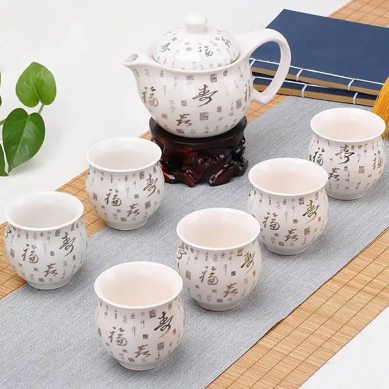 White ceramic double ceramic teaware set with black calligraphy and red seals featuring teapot and six cups on wood stand