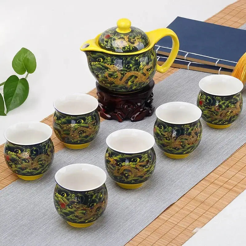 Vibrant yellow and dark green double ceramic teaware set with golden dragon motifs for dining room use
