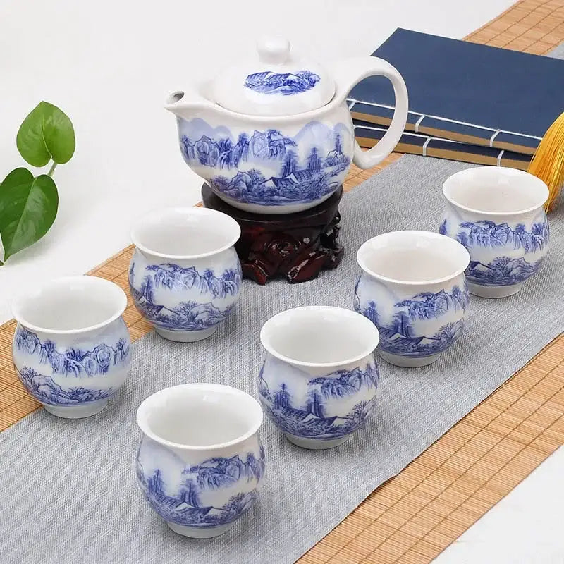 Blue and white double ceramic teaware set featuring traditional landscape designs for dining room use