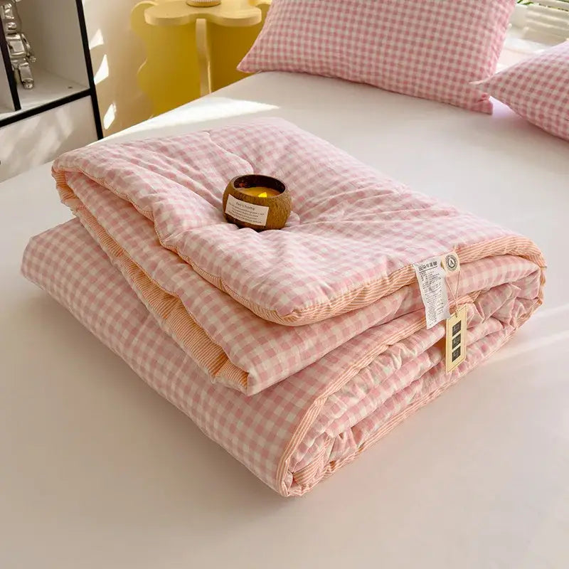 Pink and white gingham patterned cotton summer quilt with soft plush texture for bedroom comfort and soybean fiber filling