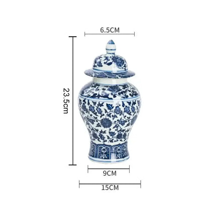 A classic blue white porcelain ginger jar with intricate floral patterns and matching lid for dining room storage