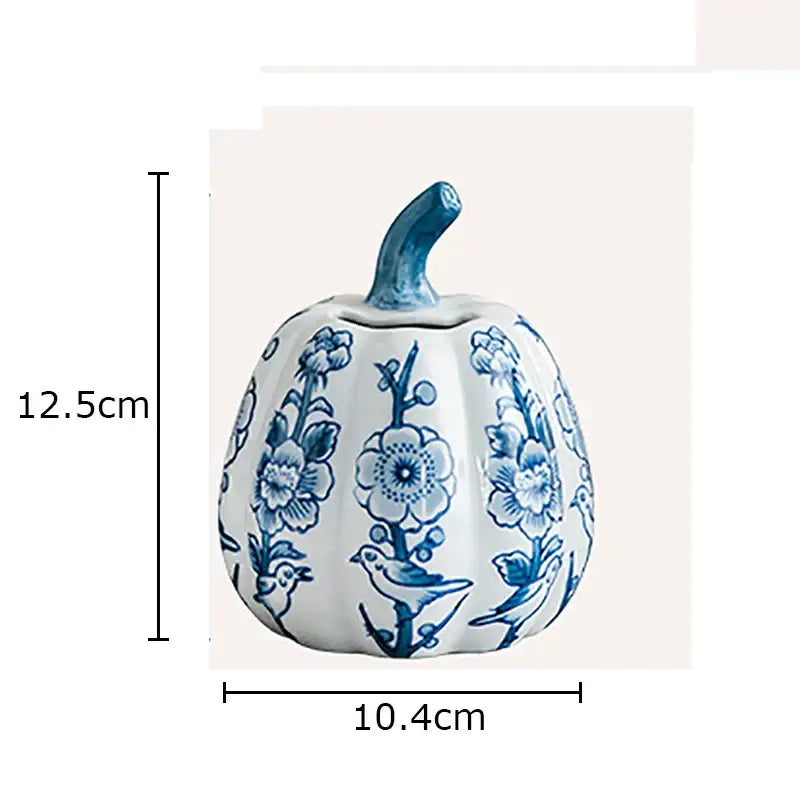 A white porcelain pumpkin vase with blue floral and bird patterns and a blue stem for living room decor