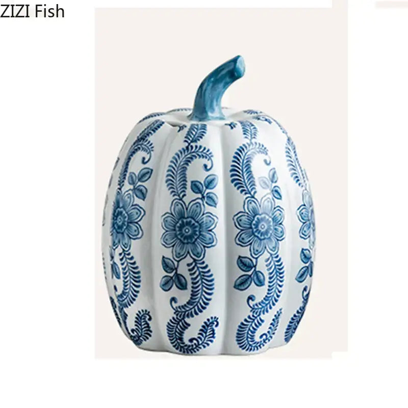 A white porcelain pumpkin vase with intricate blue white porcelain floral patterns and a matching blue stem for decor