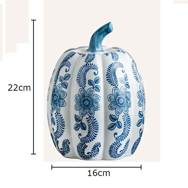 A white porcelain pumpkin vase with blue white porcelain intricate floral patterns and a matching blue stem for living room decor