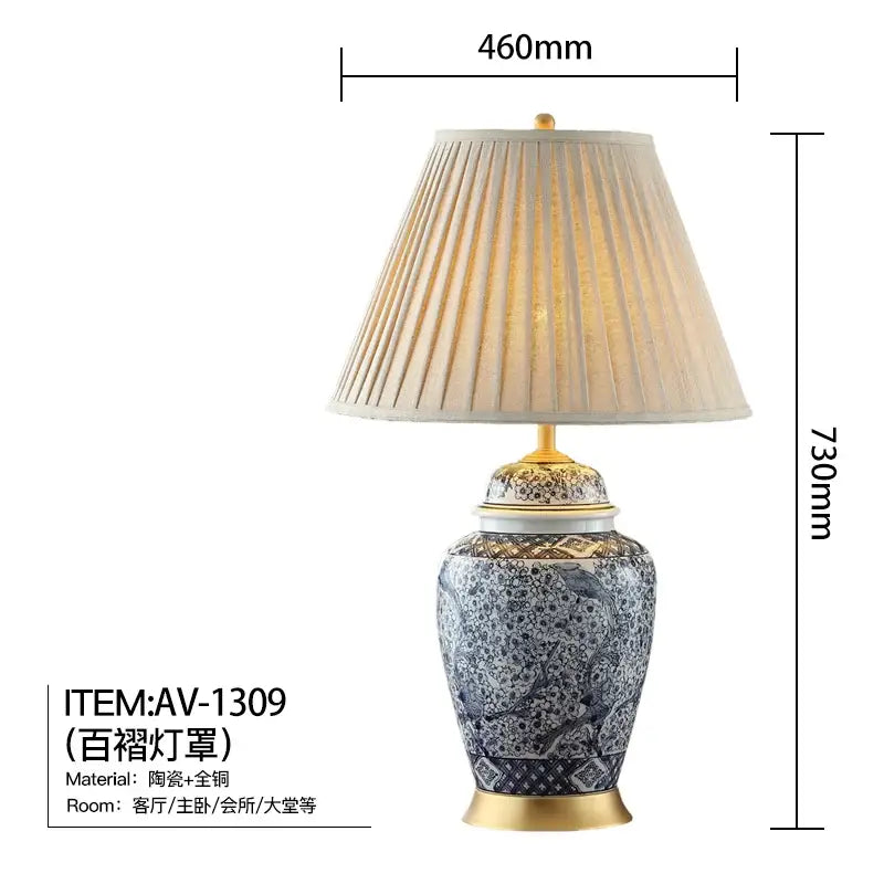 Elegant blue porcelain table lamp with white and gold accents and a pleated fabric shade for living room decorbites decor