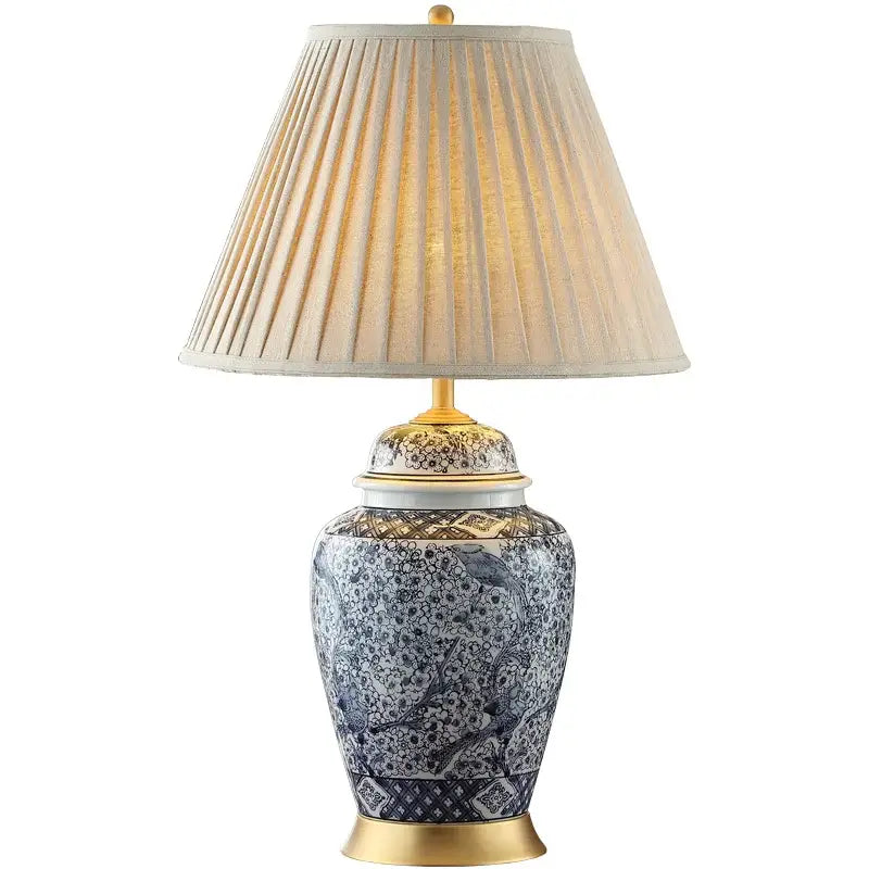 Blue and white porcelain table lamp with gold accents and intricate bird floral patterns by decorbites blue porcelain decor