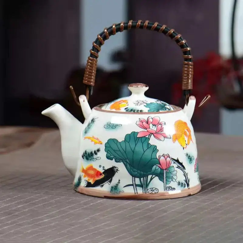 White porcelain teapot with hand-painted goldfish and lotus design and woven bamboo handle by decorbites blue